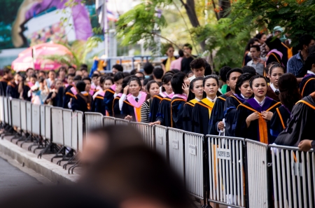 BANGKOK - March 1, 2012  Bangkok, Thailand  graduates of the Ramkumheang University walk towards Convocation Hall to receive their diplomas on March 1, 2013 のeditorial素材