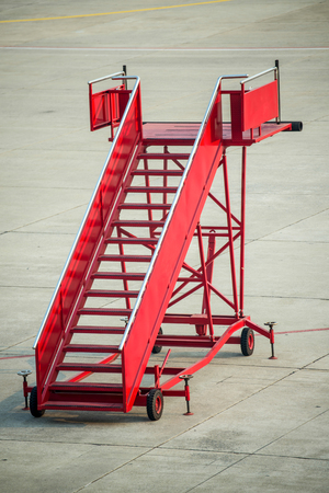 A red gangway of the plane at the airportの写真素材