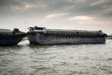A big boat carry rice in Chao Praya River ,Bangkok,Thailand 