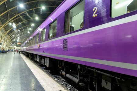 the violet train stand by at train station call Hua Lum Phong the main train in Bangkok,Thailand.の写真素材