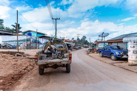 a  worker man on the rusty truck on local road.のeditorial素材