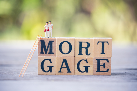 Miniature people, couple on word blockの写真素材