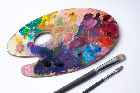 Wood palette oil paint paint brush on whiteの写真素材