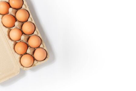 Eggs in a paper tray placed on a white background,top viewの写真素材