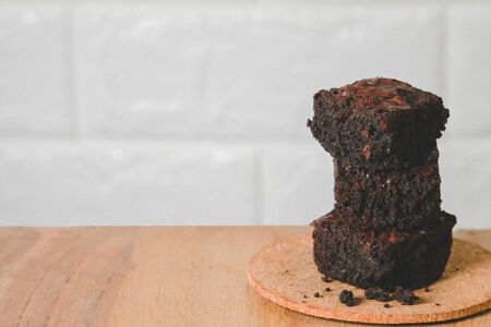 Pile of brownies on wooden floors  homemade bakery and dessertsの写真素材