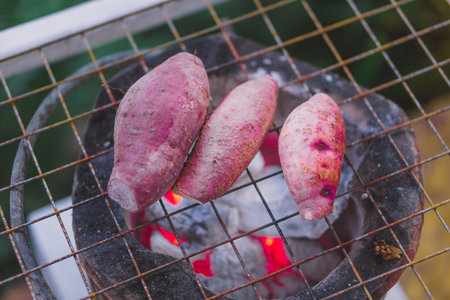 Purple potato grilled on a hot stoveの写真素材