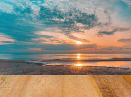 Old wooden table and sea backdropの写真素材