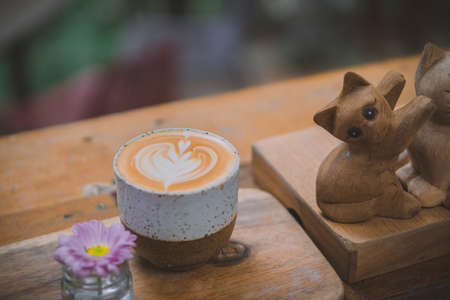 Latte coffee on wooden tableの写真素材