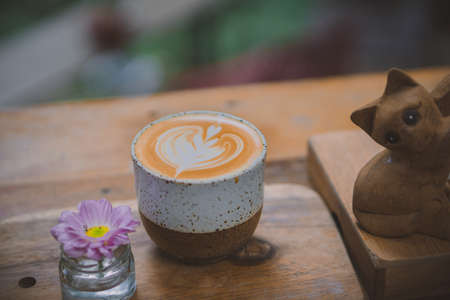 Latte coffee on wooden tableの写真素材