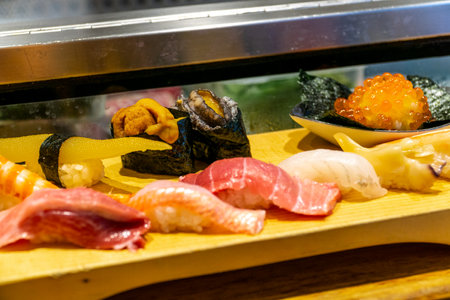 Window sushi in Japanese restaurants is a popular Japanese menu item.の写真素材