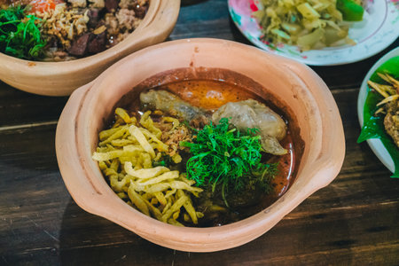Khao Soi Gai in a Clay Pot, a famous northern Thai dish that many people love.の写真素材