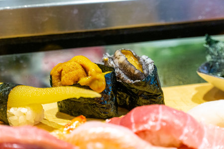 Window sushi in Japanese restaurants is a popular Japanese menu item.の写真素材