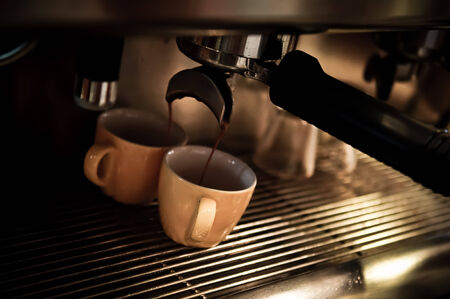 Coffee is a brewed beverage prepared from the roasted seeds of several species of an evergreen shrub of the genus Coffeaの写真素材