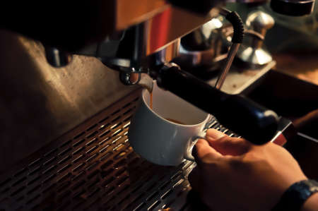 Coffee is a brewed beverage prepared from the roasted seeds of several species of an evergreen shrub of the genus Coffeaの写真素材