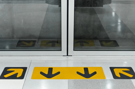 Yellow arrows indicate the entrance.の写真素材