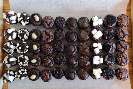 Mini bite chocolate brownies with various toping.の写真素材