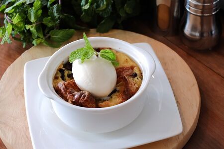 freshly baked croissants pudding with vanilla icecream.の写真素材