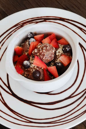 Valentine dessert chocolate icecream, choc ball and strawberries.の写真素材