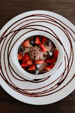 Valentine dessert chocolate icecream, choc ball and strawberriesの写真素材