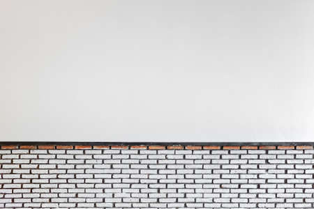 White cement and brick wall in processingの写真素材