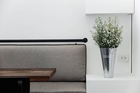 Seating in empty cafe with minimal style decorations.
