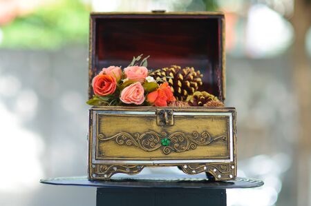 Plastic rose decoration in casket, Vintage style interior.の写真素材