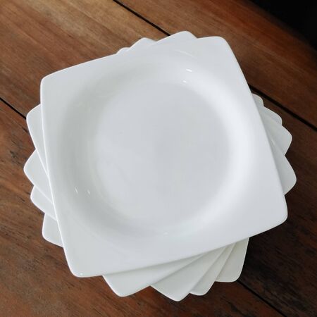 White ceramic plate on the wood table.の写真素材