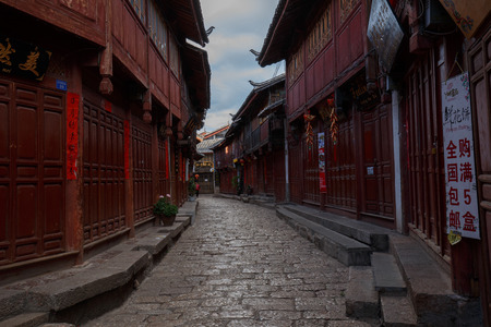 Yunnan province, China - June 21, 2015: Two local residents in a street of the Chinese Old Town of Lijiang.のeditorial素材