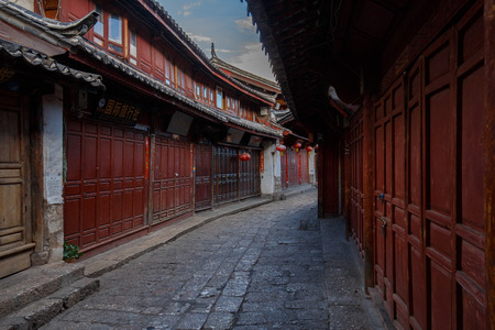 Yunnan province, China - June 21, 2015: Two local residents in a street of the Chinese Old Town of Lijiang.のeditorial素材
