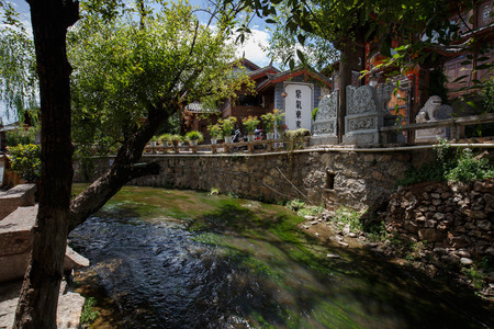 Yunnan province, China - June 21, 2015: Two local residents in a street of the Chinese Old Town of Lijiang.のeditorial素材