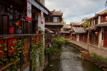 Yunnan province, China - June 21, 2015: Two local residents in a street of the Chinese Old Town of Lijiang.のeditorial素材