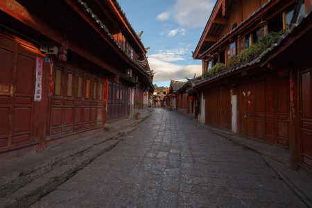 Yunnan province, China - June 21, 2015: Two local residents in a street of the Chinese Old Town of Lijiang.のeditorial素材