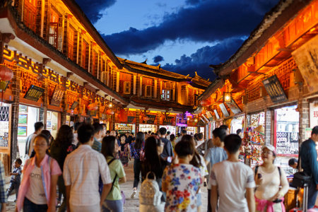 Yunnan province, China - June 21, 2015: Two local residents in a street of the Chinese Old Town of Lijiang.のeditorial素材