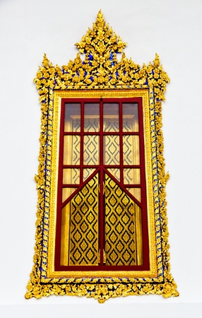Gold carved ancient window of temple  の写真素材