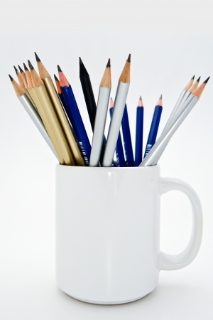 Pencils in white glass の写真素材