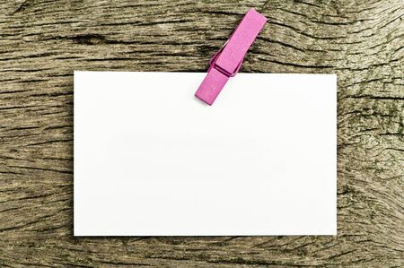 Blank paper on old wood の写真素材