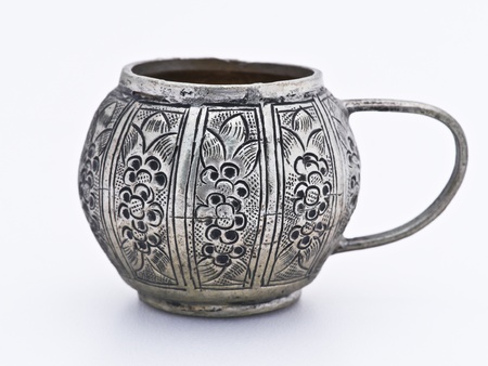 Antique tea pot and cups isolated on a white background.の写真素材