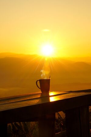 Silhouettes on sunrise morning coffee の写真素材