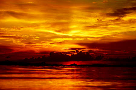 Sunset at the twilight. Beautiful clouds golden sky.の写真素材