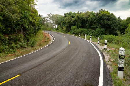 Empty curved road to the mountain.の写真素材