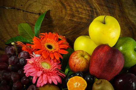 Assortment of exotic fruits on wood background.の写真素材