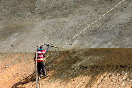 Spraying Cement into the mountains In order to prevent collapseの写真素材