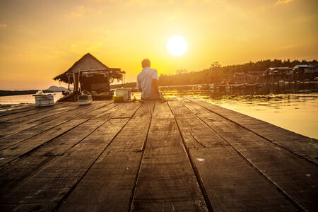 Silhouette of Fisher fishing in the Phang Nga Bey, Thailandの写真素材