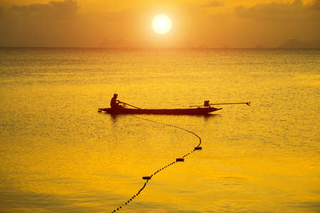 Sunset at the lake and fishing boats.の写真素材