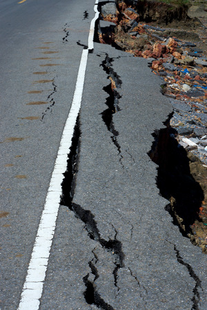 Fissures and erosion of the asphalt road by the earthquake.の写真素材