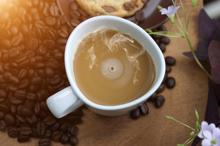Coffee and beans on a wood background.の写真素材