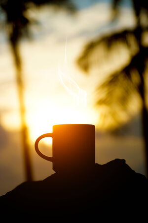 Coffee silhouettes on sunset.の写真素材