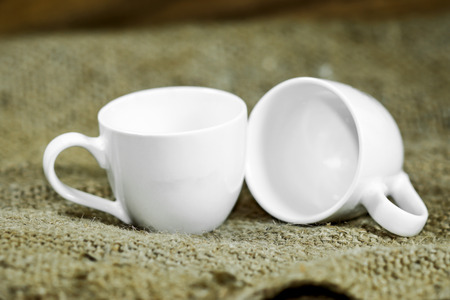 White coffee cup on a hemp sack.の写真素材