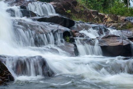 Waterfall in tropical forest at Kra Chong national park, Trang province, Thailand.の写真素材