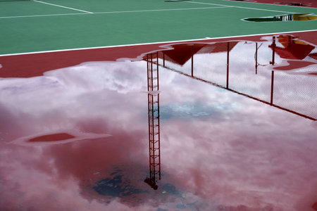 Rainwater on the tennis courtの写真素材